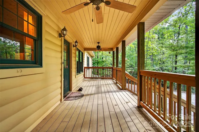 a view of a balcony with wooden floor