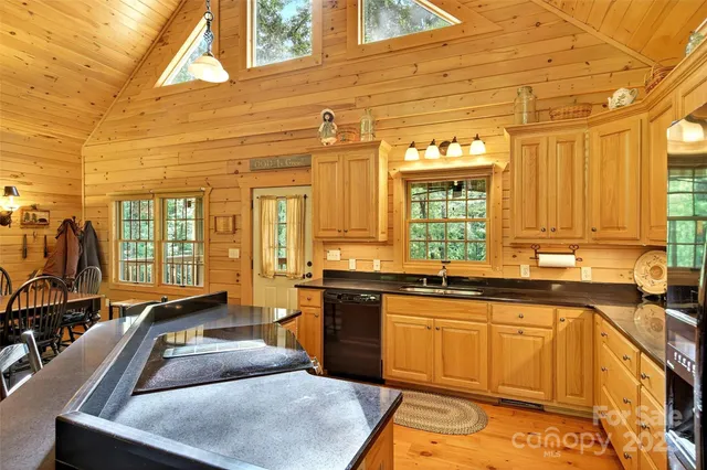 a kitchen with a sink and a stove top oven