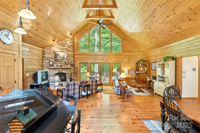 a living room with lots of furniture and a large window