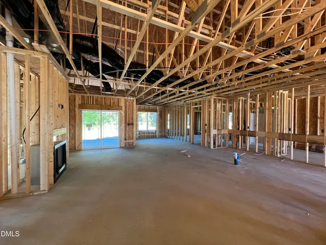 a view of an empty room with windows