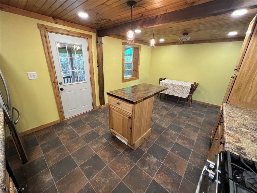 6544 Middle Run Road Dover, OH 44622 - Photo 10 of 47 Kitchen with wooden ceiling, decorative light fixtures, dark tile flooring, and beam ceiling