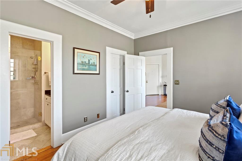 1 South Prado Northeast, Unit 5 Atlanta, GA 30309 - Photo 18 of 33 a bedroom with a bed and a view of bathroom