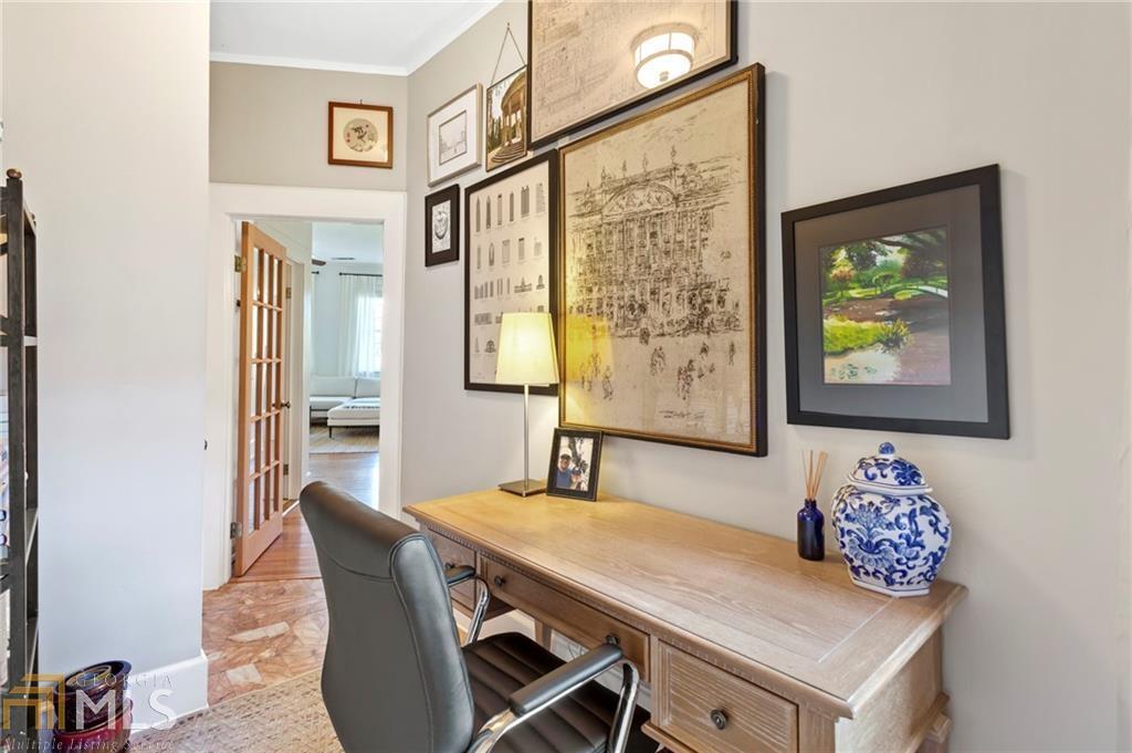 1 South Prado Northeast, Unit 5 Atlanta, GA 30309 - Photo 21 of 33 a view of a dining room with furniture and a large window