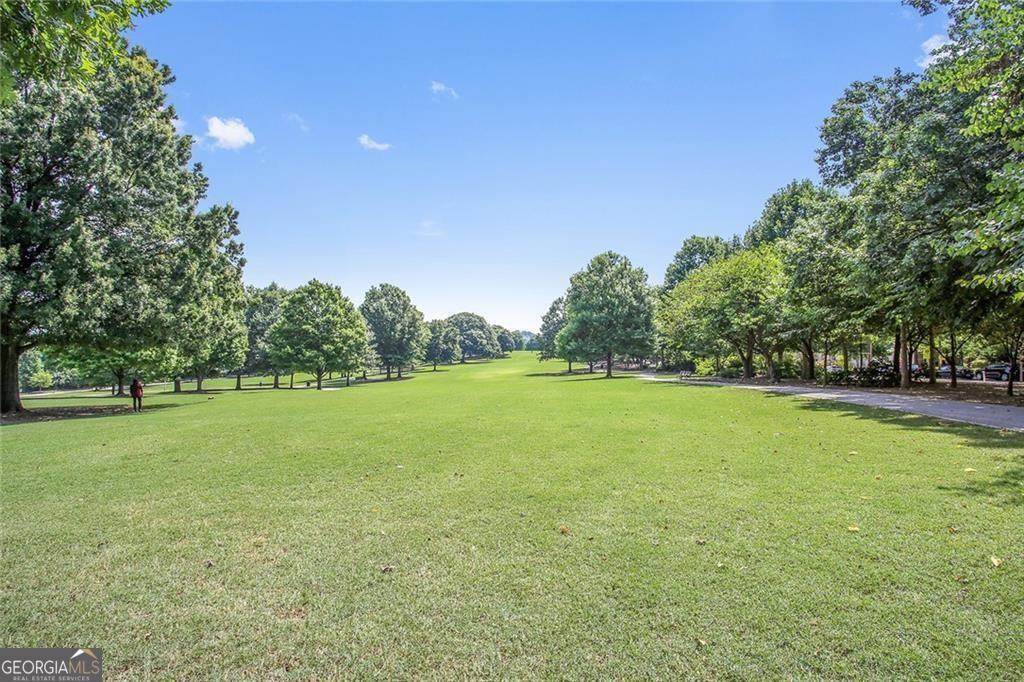 1 South Prado Northeast, Unit 5 Atlanta, GA 30309 - Photo 27 of 33 a view of a field with trees in the background