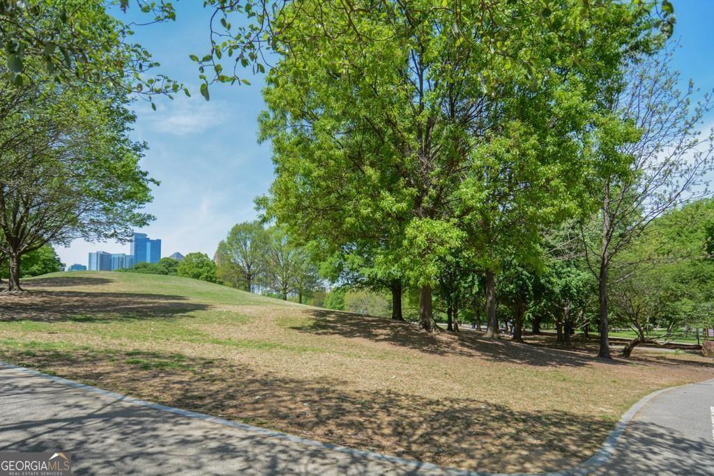 1 South Prado Northeast, Unit 5 Atlanta, GA 30309 - Photo 28 of 33 a view of a yard with plants and trees