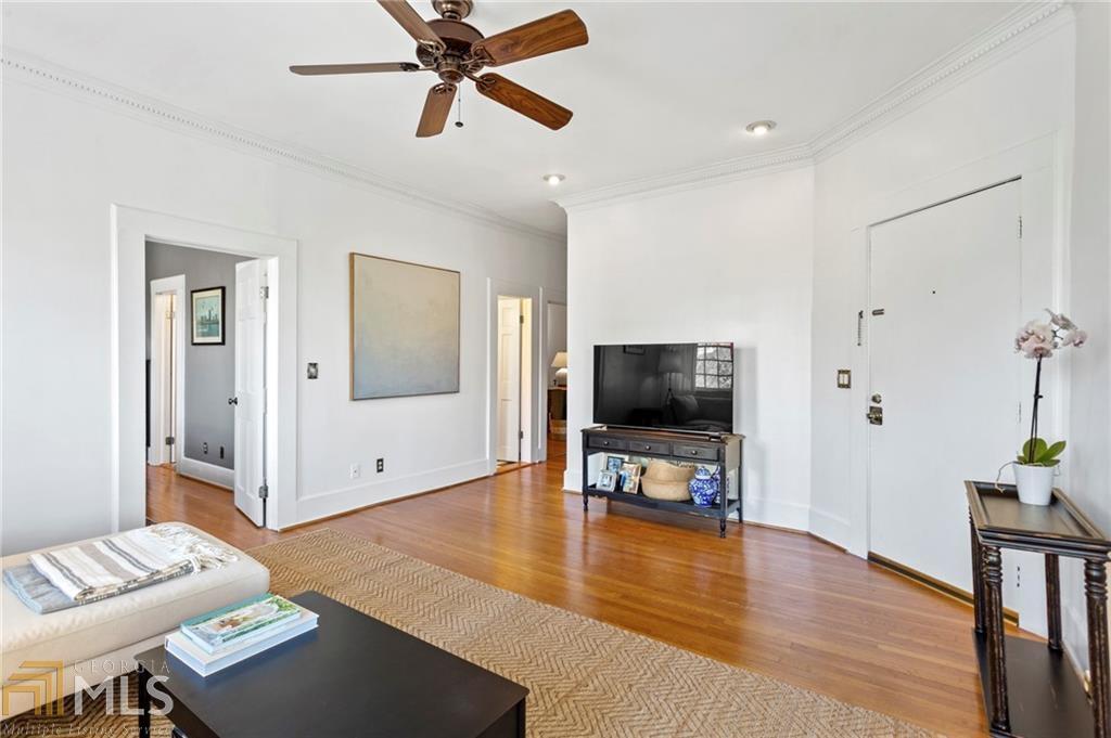1 South Prado Northeast, Unit 5 Atlanta, GA 30309 - Photo 6 of 33 a living room with furniture and a flat screen tv