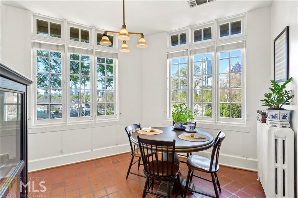 1 South Prado Northeast, Unit 5 Atlanta, GA 30309 - Photo 9 of 33 a view of a dining room with furniture window and outside view