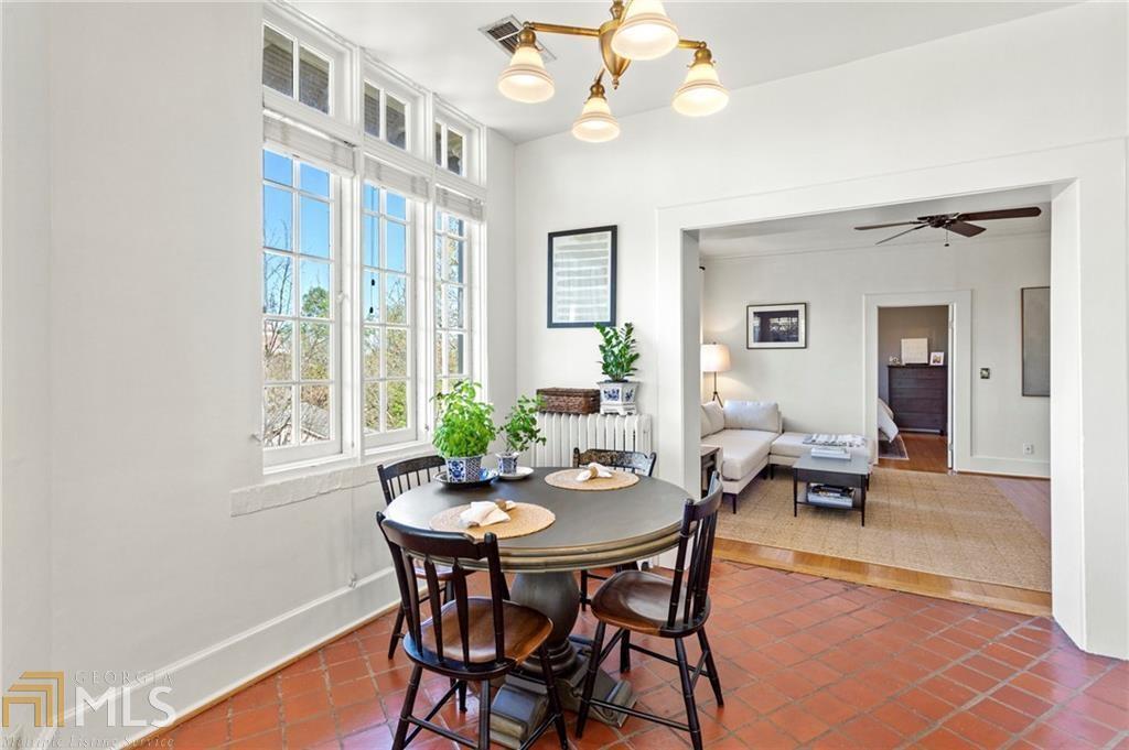 1 South Prado Northeast, Unit 5 Atlanta, GA 30309 - Photo 10 of 33 a view of a dining room with furniture and chandelier