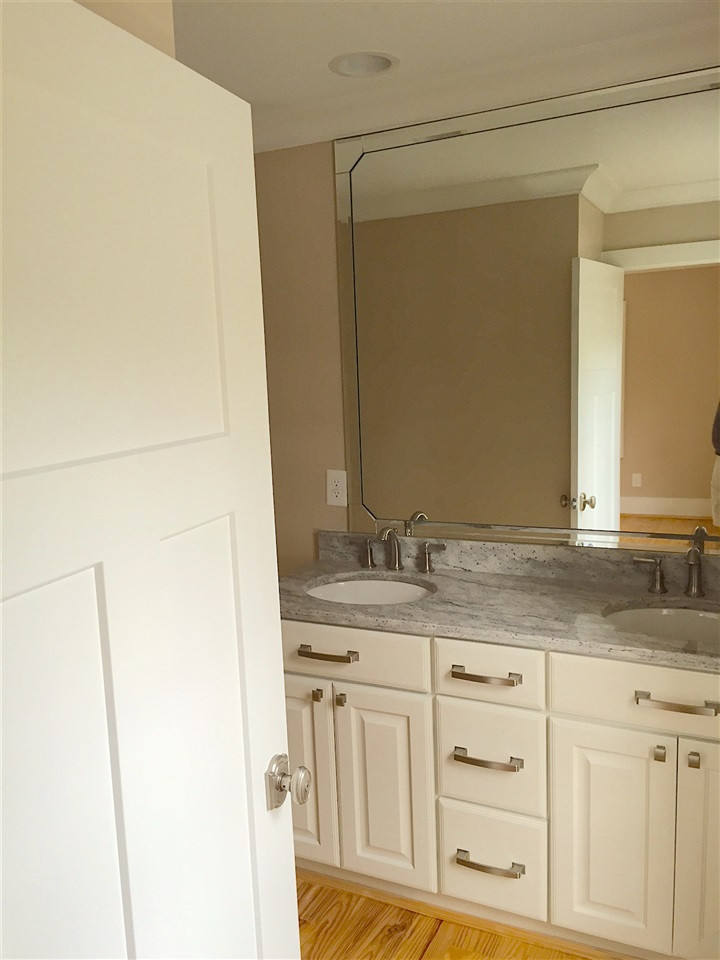 3132 Stanhope Avenue Raleigh, NC 27607 - Photo 7 of 11 Master Bath Features a Double Vanity, Custom Cabinet, Granite Counter, Kohler Fixtures, a LARGE Shower, Hardwood Floors, and Natural Light! Master Bath/Spa