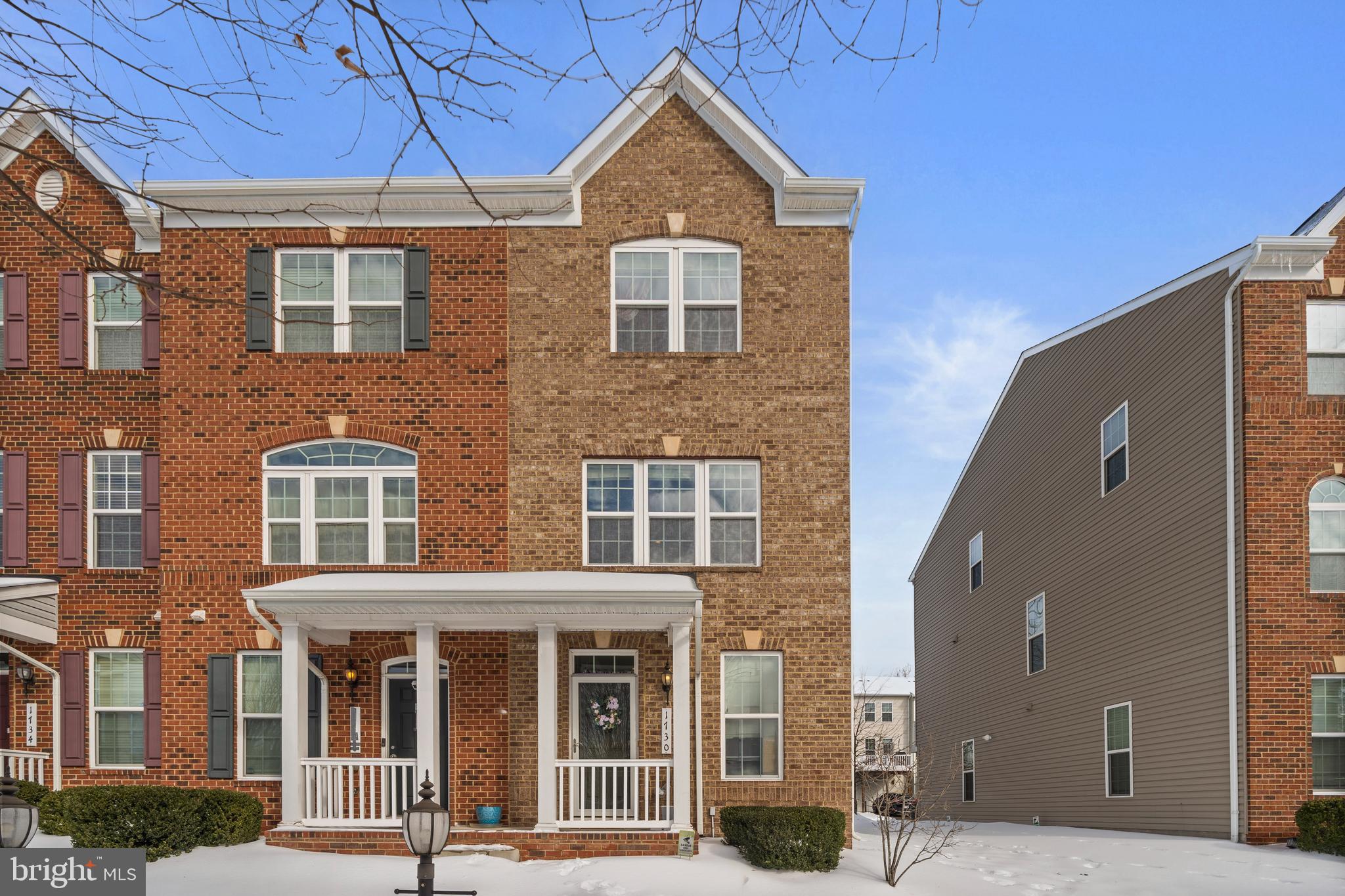 a front view of a building with a yard