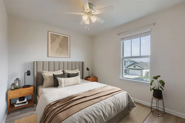 a bedroom with bed and window