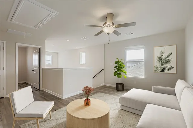 a living room with furniture and a lamp