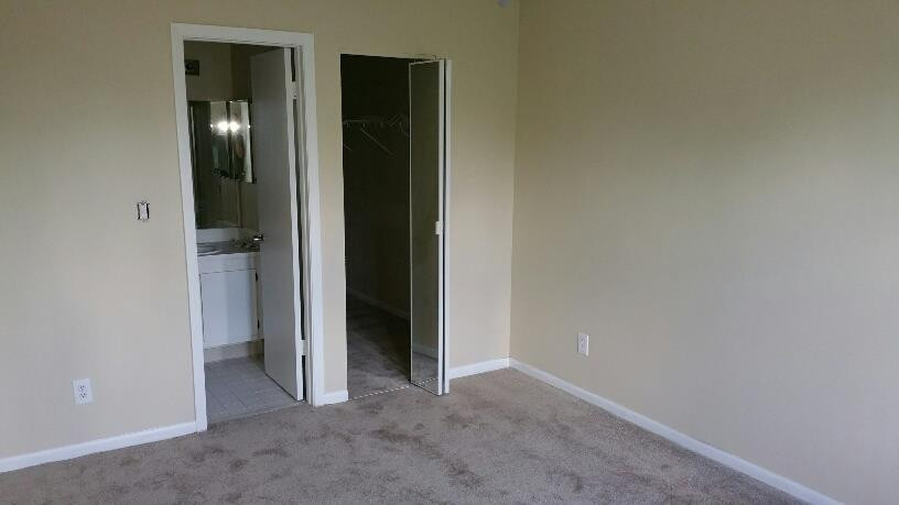 5282 Gate Lake Road, Unit 5282 Tamarac, FL 33319 - Photo 4 of 8 an empty room with closet and bathroom