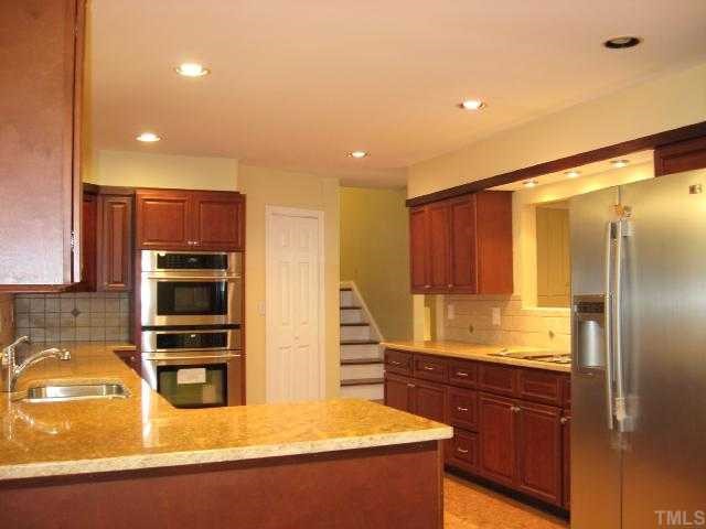 1402 Woodburn Road Durham, NC 27705 - Photo 4 of 9 Beautiful new kitchen with cork floor and stainless steel appliances