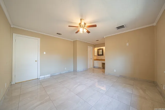 a view of an empty room with a window