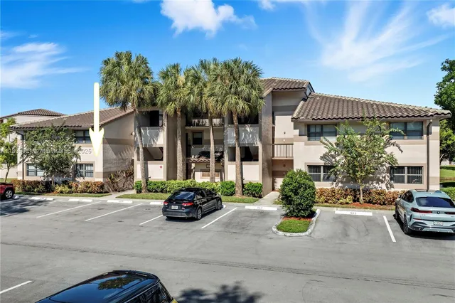 a car parked in front of a brick house