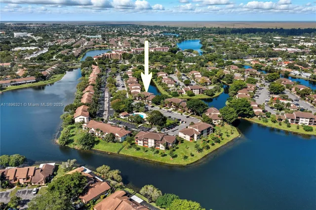 an aerial view of a house with a lake view