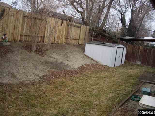 685 Nancy Circle Reno, NV 89503 - Photo 7 of 9 a view of backyard with wooden fence