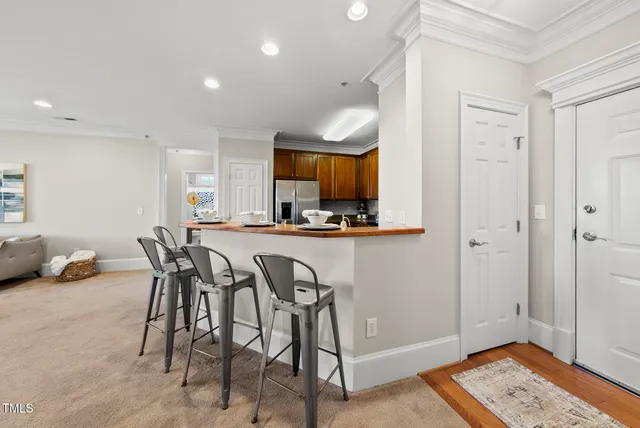a kitchen with a table and chairs in it