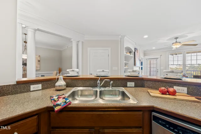 a kitchen with a sink and cabinets