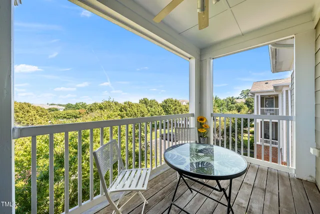 a view of balcony with wooden floor
