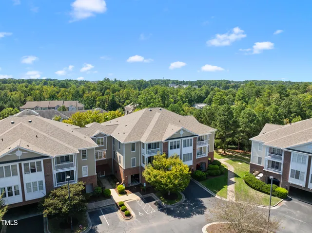 a view of a lake with a house in the background