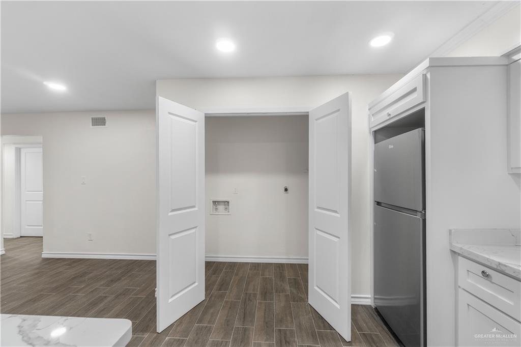 211 Gastel Circle, Unit 2 Edinburg, TX 78539 - Photo 11 of 22 wooden floor in an empty room with wooden floor