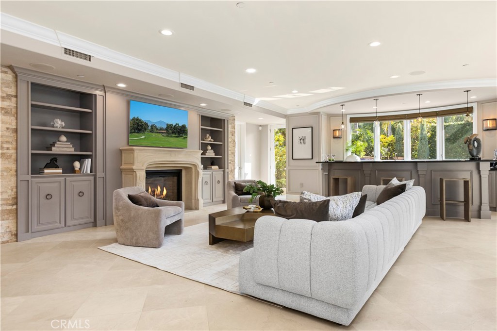 96 Ritz Cove Drive Dana Point, CA 92629 - Photo 14 of 41 Great Room with fireplace, Built in Bar and direct access to backyard and pool/spa