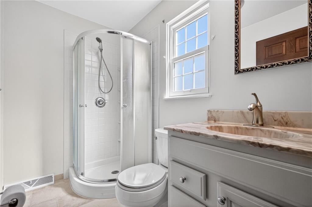 110 Spring Drive Apollo, PA 15613 - Photo 15 of 50 a bathroom with a granite countertop sink toilet and shower