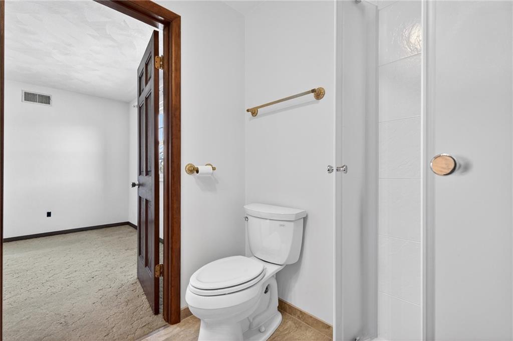 110 Spring Drive Apollo, PA 15613 - Photo 31 of 50 a white toilet sitting next to a bathroom sink