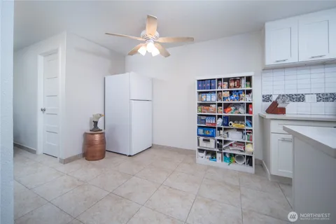 a room with a book shelf and a cabinets