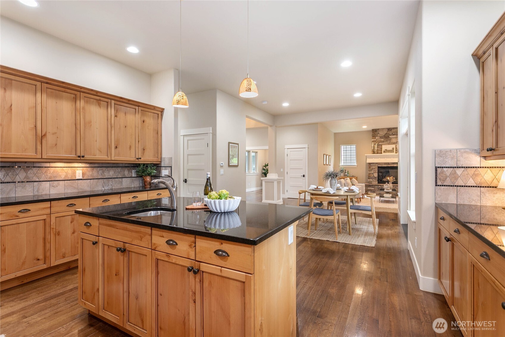 61 Windward Drive Bellingham, WA 98229 - Photo 13 of 36 a kitchen with stainless steel appliances granite countertop a refrigerator a sink dishwasher a stove and white cabinets with wooden floor