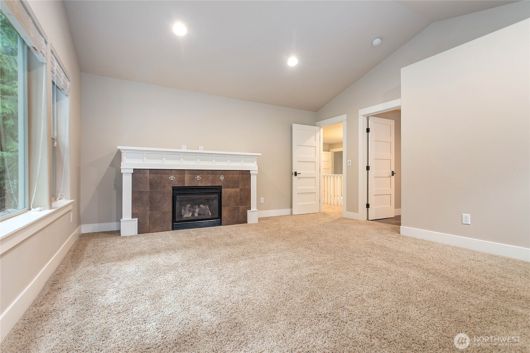 61 Windward Drive Bellingham, WA 98229 - Photo 22 of 36 a view of an empty room with a window and fireplace
