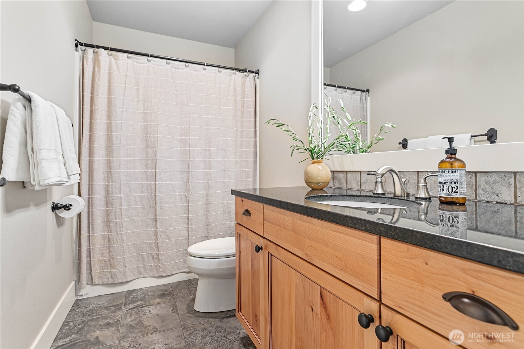 61 Windward Drive Bellingham, WA 98229 - Photo 30 of 36 a bathroom with a sink a toilet and shower curtain