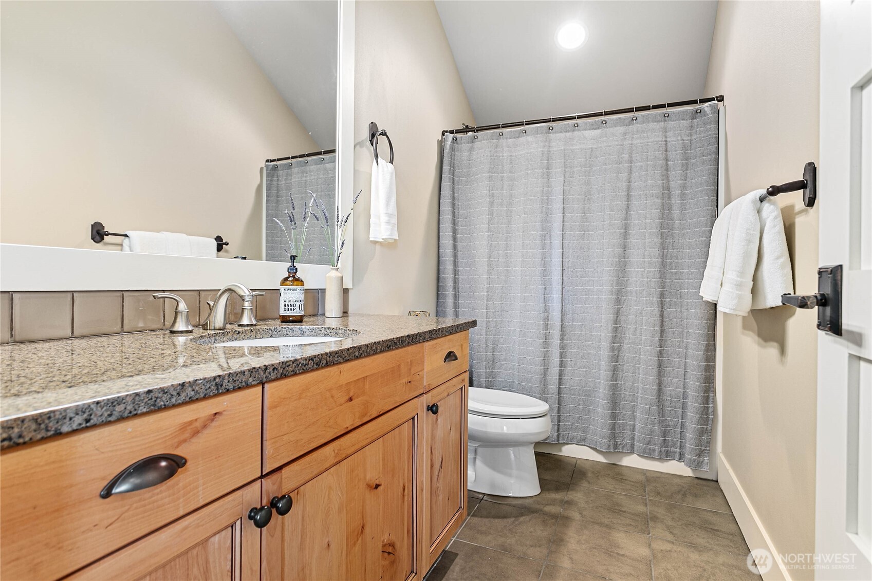 61 Windward Drive Bellingham, WA 98229 - Photo 34 of 36 a bathroom with a granite countertop sink and a mirror