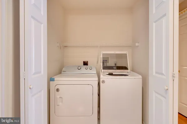 a bathroom with a sink a toilet and shower curtain