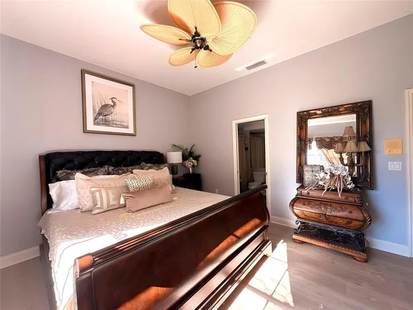 a bedroom with bed and window