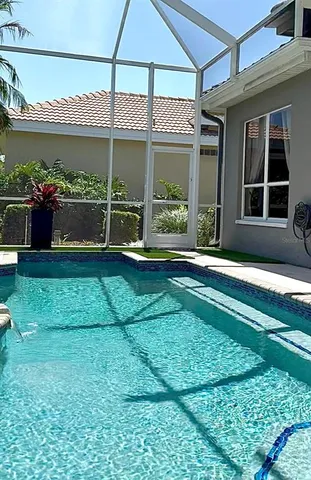 a front view of a house with a yard table and chairs
