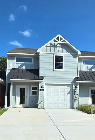 a front view of a house with a garage