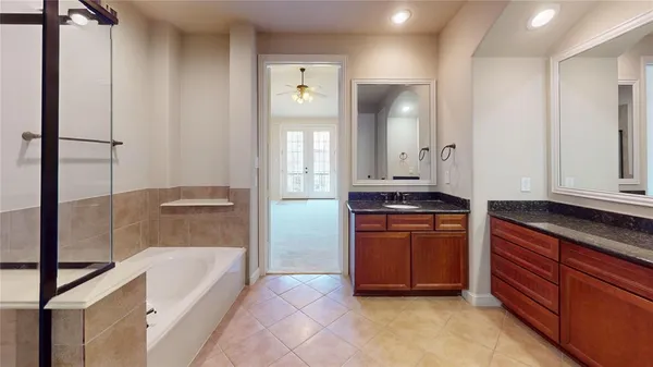 a bathroom with a bathtub and a sink