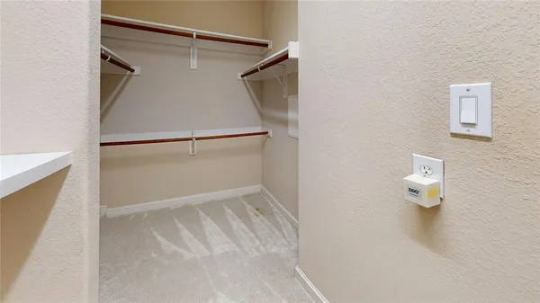 a bathroom with a refrigerator
