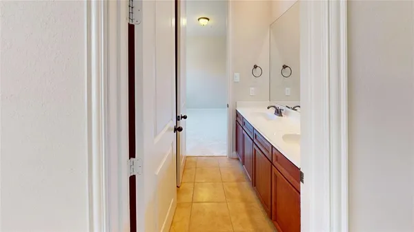a bathroom with a vanity and a mirror
