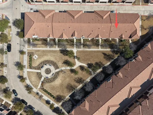 an aerial view of a house with outdoor space