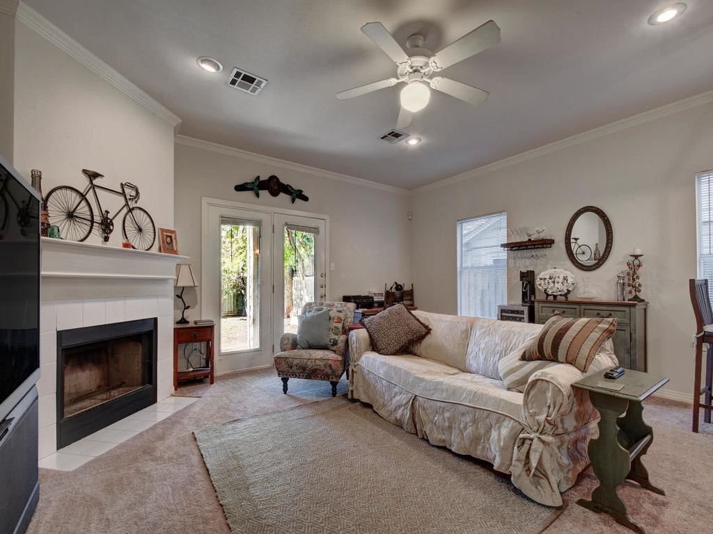 a living room with furniture and a fireplace
