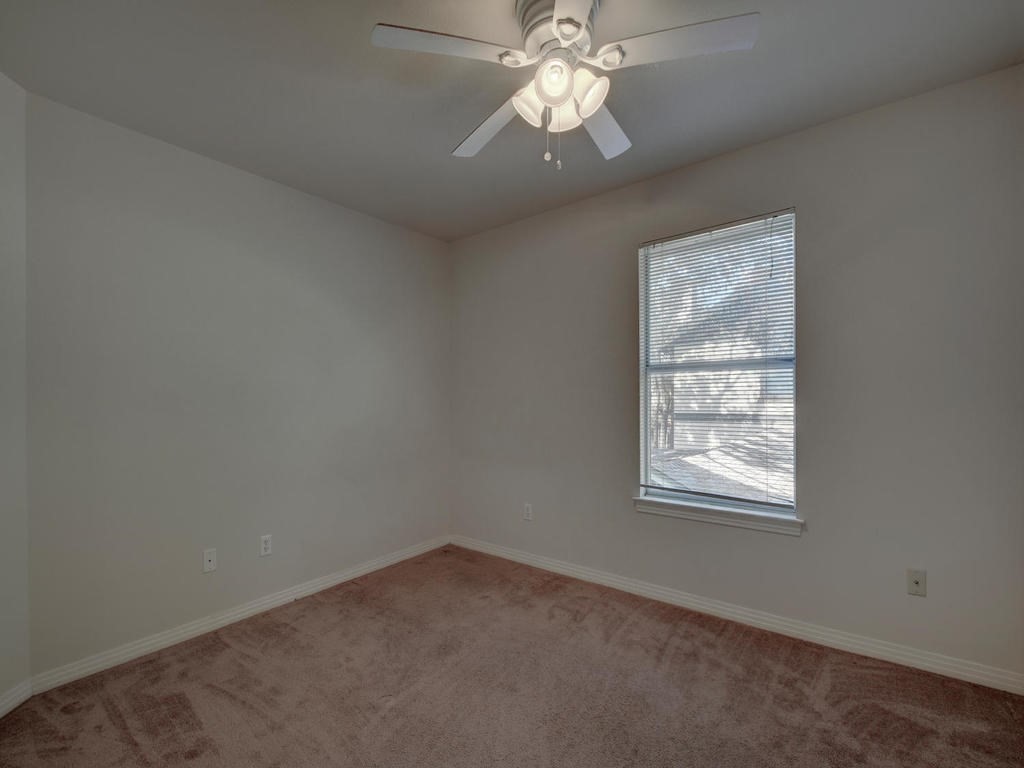 609 East 49th Street, Unit B Austin, TX 78751 - Photo 14 of 19 an empty room with a window