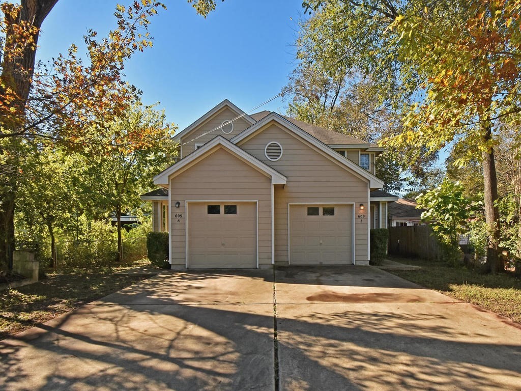 609 East 49th Street, Unit B Austin, TX 78751 - Photo 18 of 19 a house with trees in the background