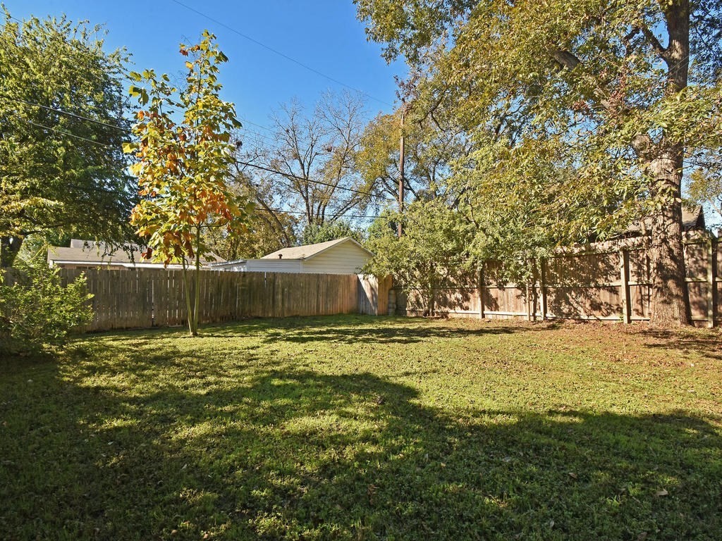 609 East 49th Street, Unit B Austin, TX 78751 - Photo 19 of 19 a backyard of a house with large trees
