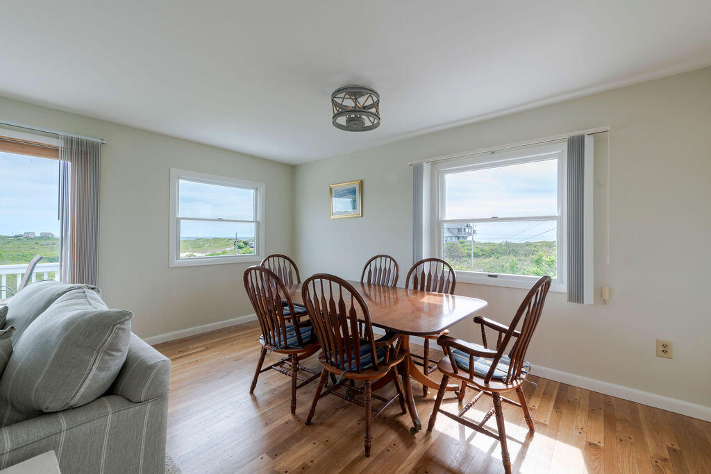 2 Ryder Hollow Road Truro, MA 02666 - Photo 12 of 33 a view of a dining room with furniture and a window