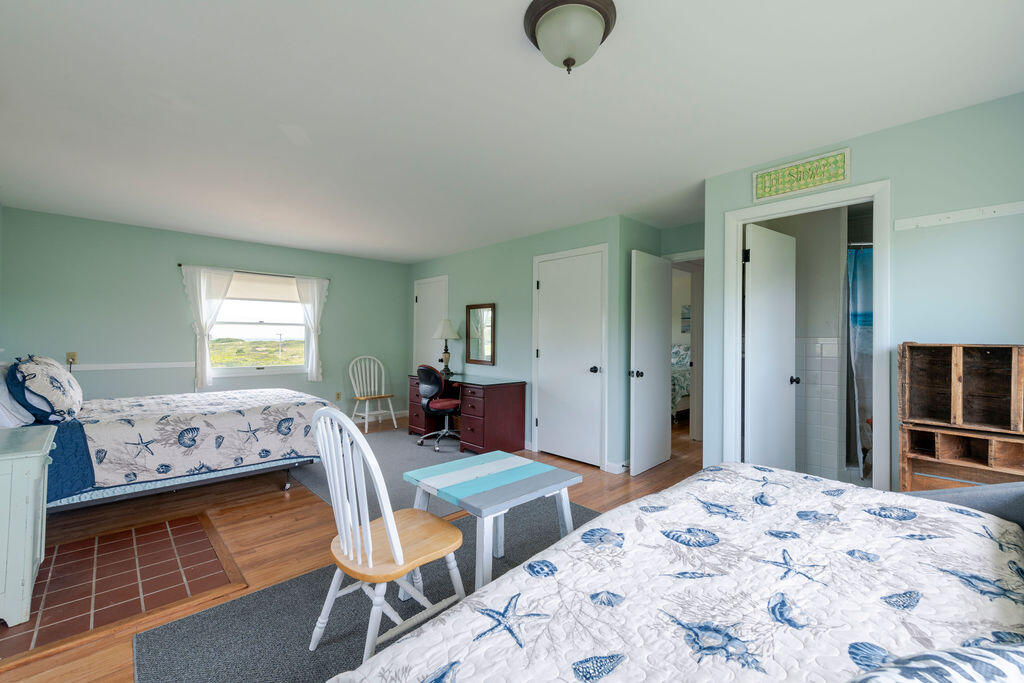 2 Ryder Hollow Road Truro, MA 02666 - Photo 19 of 33 a bedroom with a bed and a window