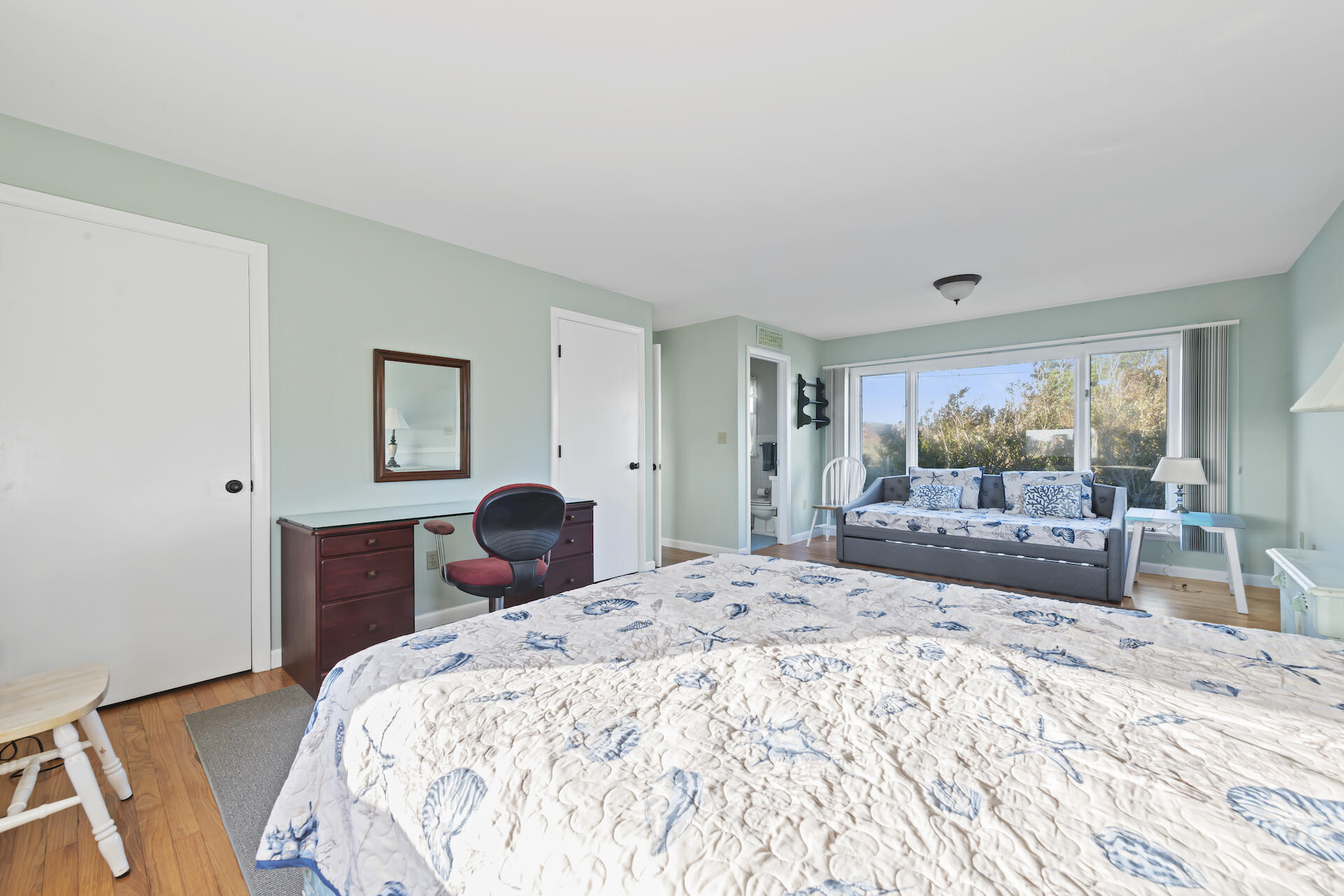 2 Ryder Hollow Road Truro, MA 02666 - Photo 20 of 33 a bedroom with a bed and wooden floor
